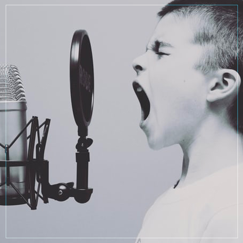 Child Speaking to a Mic