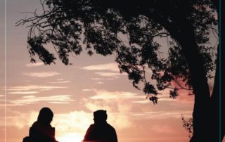 Two people watching the sunset